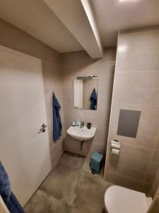 Koupelna v ubytování Rooms Optim