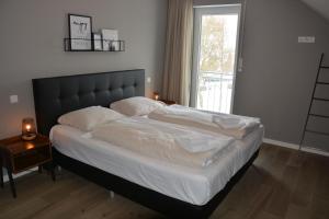 Postelja oz. postelje v sobi nastanitve Vakantiehuiswinterberg