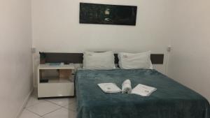Ein Bett oder Betten in einem Zimmer der Unterkunft Pousada El Shaddai