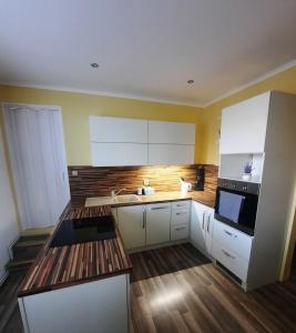 Kuchyň nebo kuchyňský kout v ubytování Apartmán Sandra