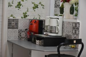 a table with a coffee maker on top of it at MARINA BAY in Terrasini