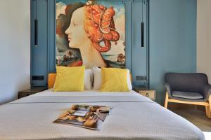 a bed with a picture of a woman on it at Neva Kaş in Kaş