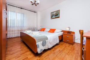 Postel nebo postele na pokoji v ubytování Apartments Valdibora