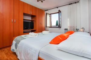 Postel nebo postele na pokoji v ubytování Apartments Valdibora