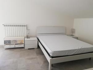 A bed or beds in a room at Attico fronte mare