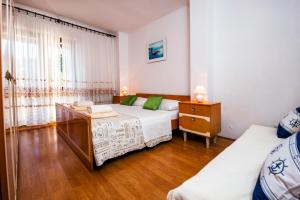 Postel nebo postele na pokoji v ubytování Apartments Valdibora