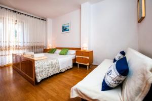 Postel nebo postele na pokoji v ubytování Apartments Valdibora