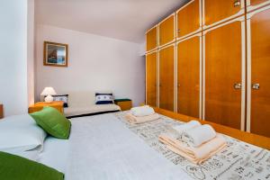 Postel nebo postele na pokoji v ubytování Apartments Valdibora