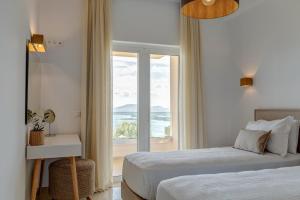 Voodi või voodid majutusasutuse Bolla D'Oro Luxury Villas toas