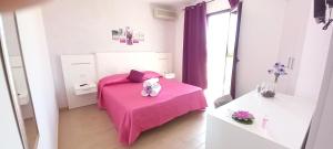 A bed or beds in a room at Tesori del Salento