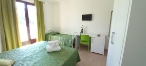 A bed or beds in a room at Tesori del Salento