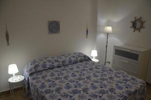 Postel nebo postele na pokoji v ubytování Casa Vacanza AMARE MONDELLO