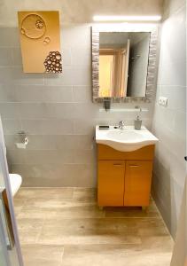 a bathroom with a sink and a mirror at Casa l'Escorretger in Calaceite