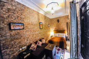Voodi või voodid majutusasutuse Riad Errabii & Spa toas