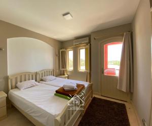 Легло или легла в стая в Taj Home, Amazing pool and lagoon view 2bedrooms apartment