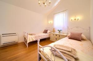 Postel nebo postele na pokoji v ubytování Villa San Vito