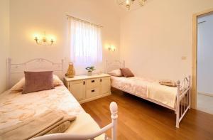 Postel nebo postele na pokoji v ubytování Villa San Vito