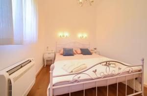 Postel nebo postele na pokoji v ubytování Villa San Vito