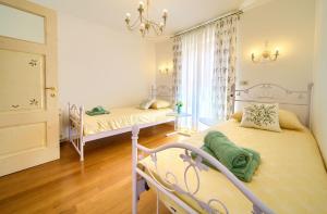 Postel nebo postele na pokoji v ubytování Villa San Vito
