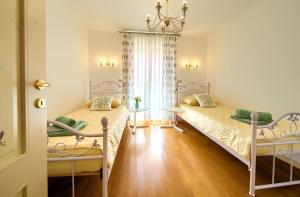 Postel nebo postele na pokoji v ubytování Villa San Vito
