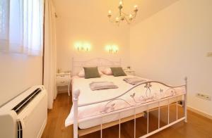 Postel nebo postele na pokoji v ubytování Villa San Vito