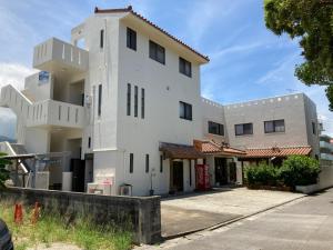an exterior view of a white building at Joya in Ishigaki Island