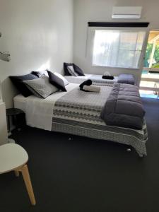 Uma cama ou camas num quarto em Jabiru Motel