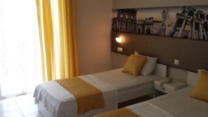 Postel nebo postele na pokoji v ubytování Blue Nest Hotel
