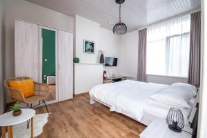 Postel nebo postele na pokoji v ubytování De Zonnetuin