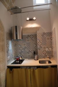 Kuchyň nebo kuchyňský kout v ubytování Chianca d l'ora - White Stone Suite