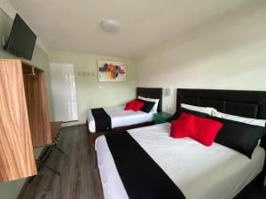 Ένα ή περισσότερα κρεβάτια σε δωμάτιο στο Vista Zacatlan Hotel