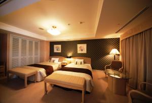 Voodi või voodid majutusasutuse Numazu River Side Hotel toas +37 fotot
