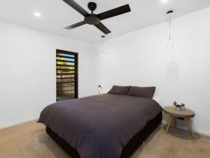 A bed or beds in a room at CABARITA BEACH HOUSE 53