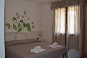 Posteľ alebo postele v izbe v ubytovaní Albergo Grobberio