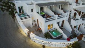 an aerial view of a house with a swimming pool at Villa Elina suites and more in Agios Stefanos