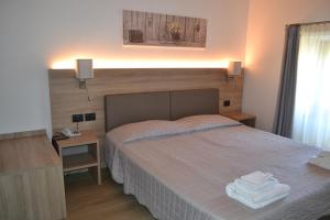 Posteľ alebo postele v izbe v ubytovaní Albergo Grobberio