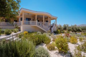a house in the desert with a garden at Andrea Villa by Prestige Bookings in Peyia