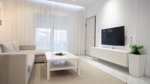 TV a/nebo společenská místnost v ubytování Luxury Apt 115m2