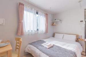 Postel nebo postele na pokoji v ubytování japan house edogawabashi
