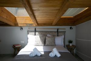 Ліжко або ліжка в номері The Euphoria Club Luxury Villas