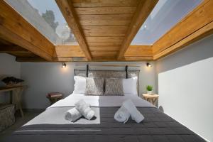 Ліжко або ліжка в номері The Euphoria Club Luxury Villas