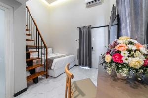 Llit o llits en una habitació de Tree Homestay Mitra RedDoorz