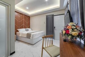 Llit o llits en una habitació de Tree Homestay Mitra RedDoorz