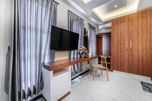 Televisor o centre d'entreteniment de Tree Homestay Mitra RedDoorz