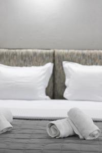 Ліжко або ліжка в номері The Euphoria Club Luxury Villas
