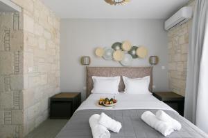 Ліжко або ліжка в номері The Euphoria Club Luxury Villas