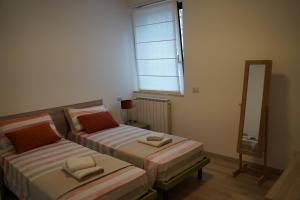 Katil atau katil-katil dalam bilik di San Martino Lake View Apartment
