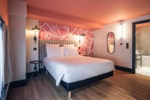 Postel nebo postele na pokoji v ubytování Le Grand Hotel
