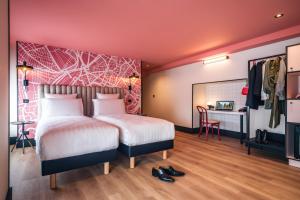 Postel nebo postele na pokoji v ubytování Le Grand Hotel