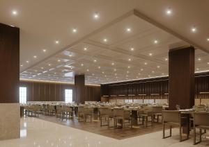 a large banquet hall with tables and chairs at Ring Downtown Hotel in Antalya